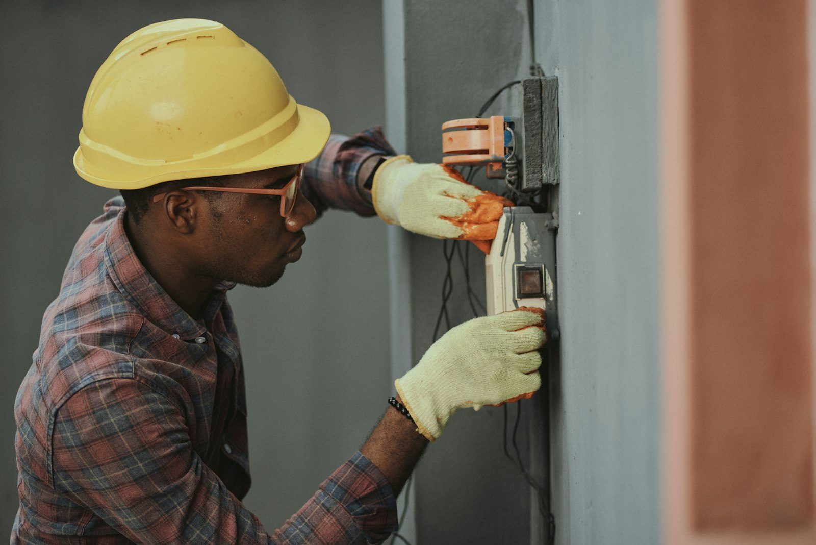 North Pole technician servicing an HVAC control unit