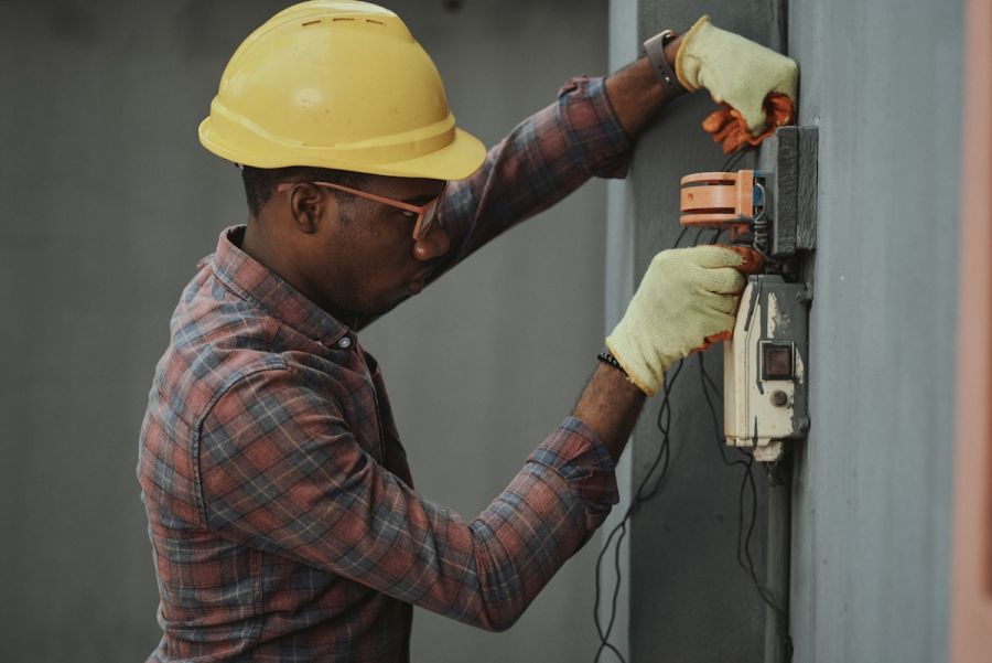 Technician working on air conditioning wiring