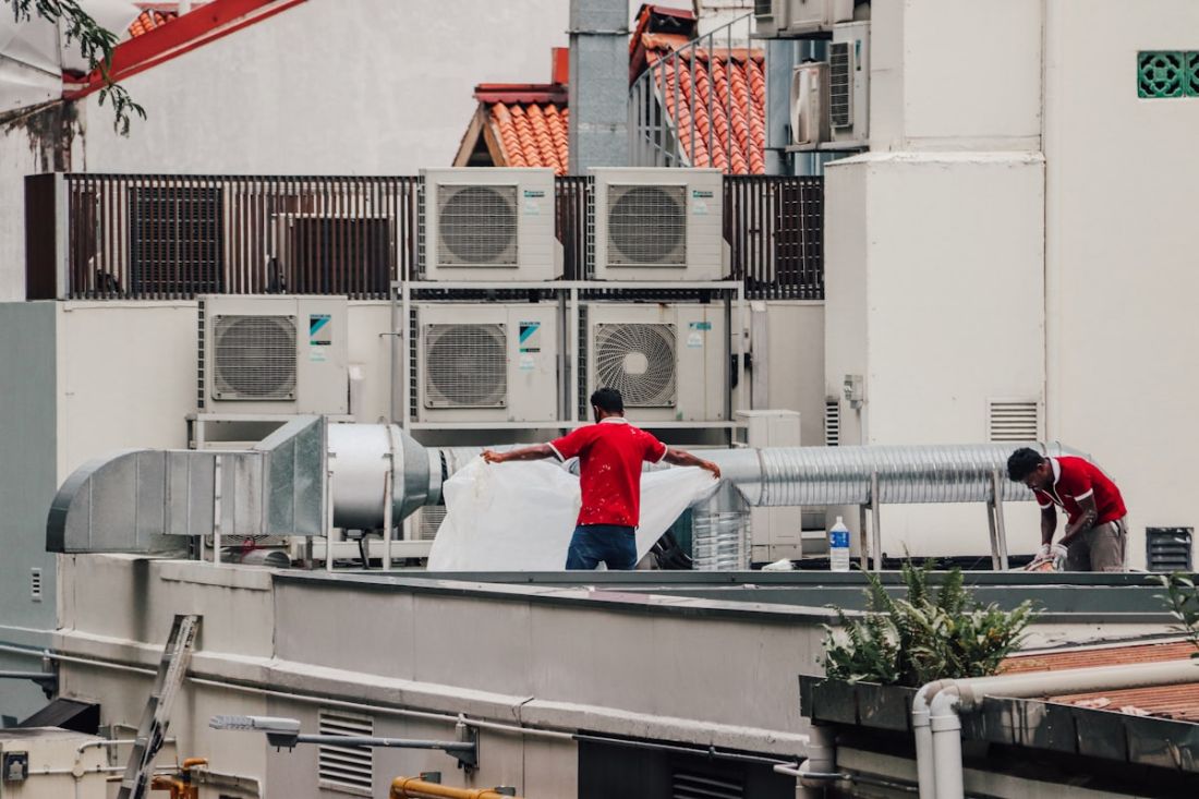 North Pole technicians servicing rooftop HVAC equipment